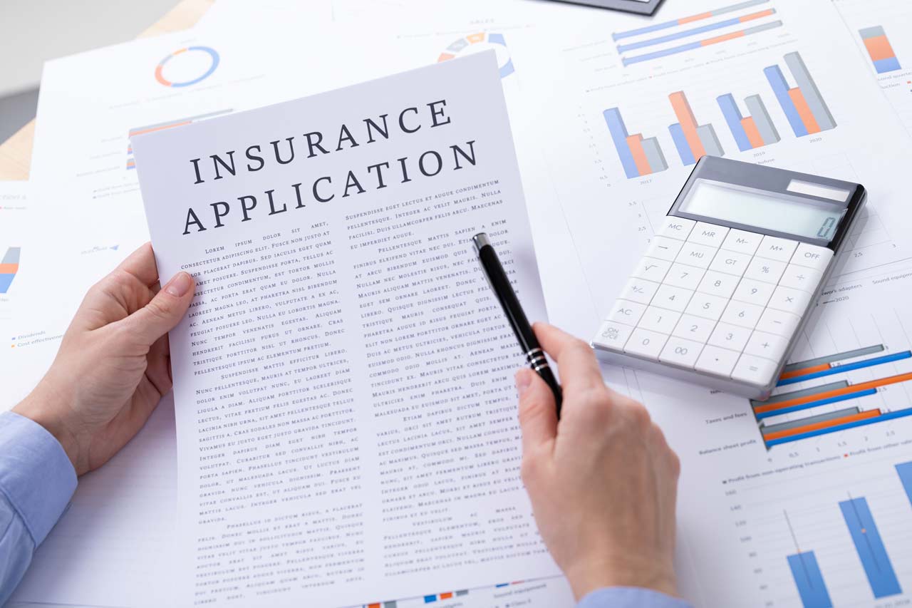 insurance application concept, documents on the desktop